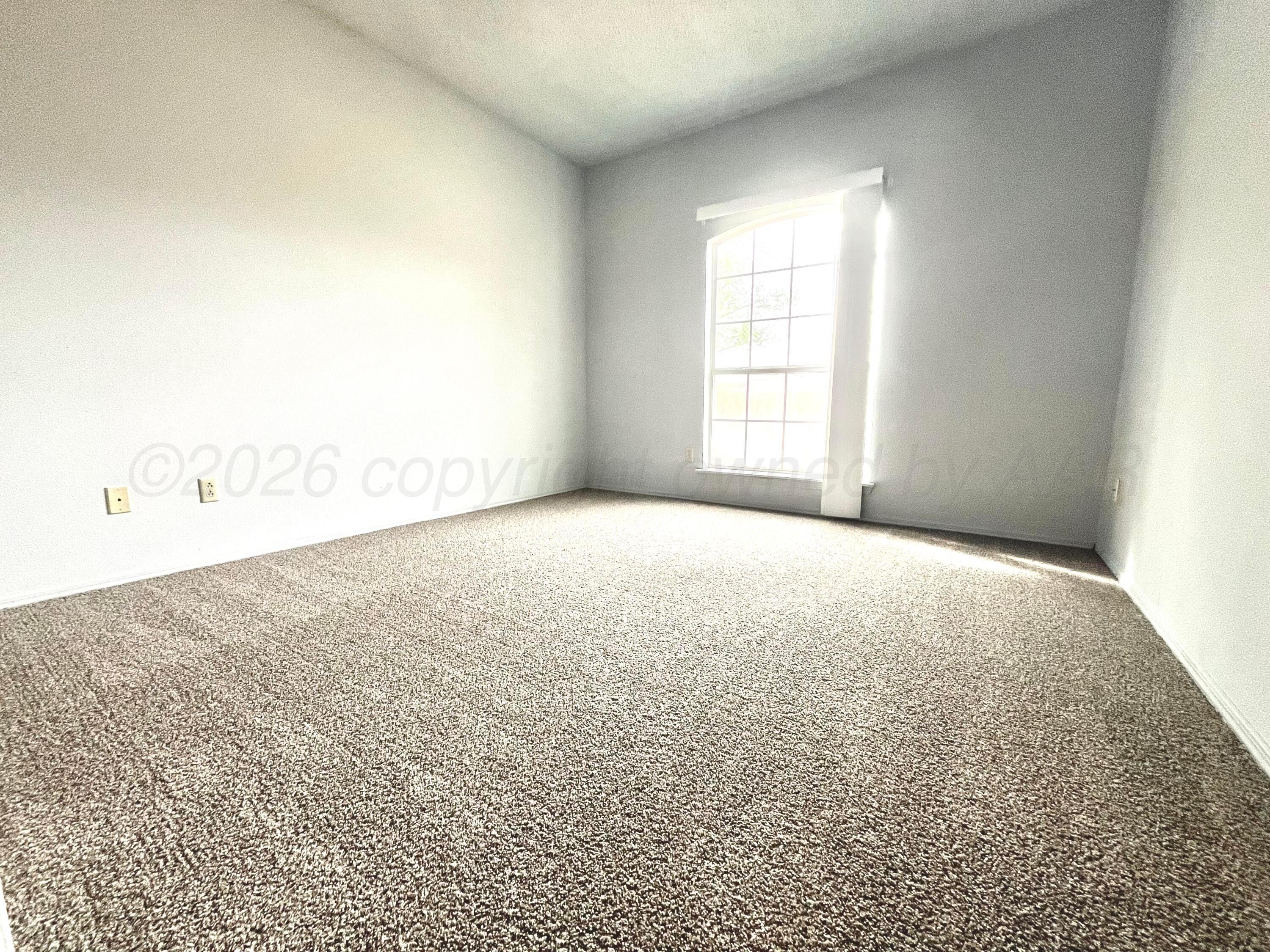 7628 Catskill Avenue Amarillo, TX 79121 - Photo 14 of 16 a view of empty room with window