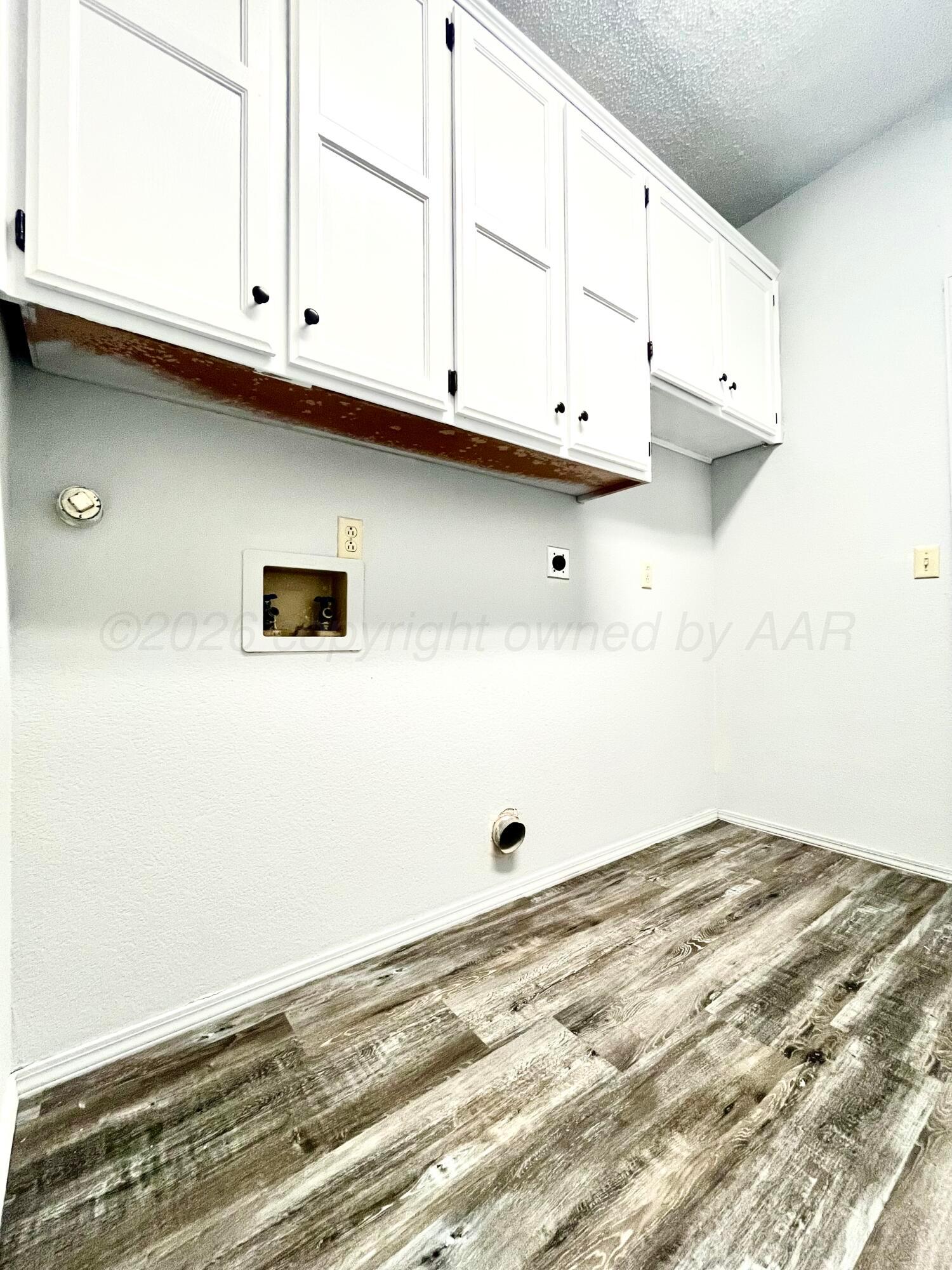 7628 Catskill Avenue Amarillo, TX 79121 - Photo 8 of 16 a view of kitchen with granite countertop white cabinets