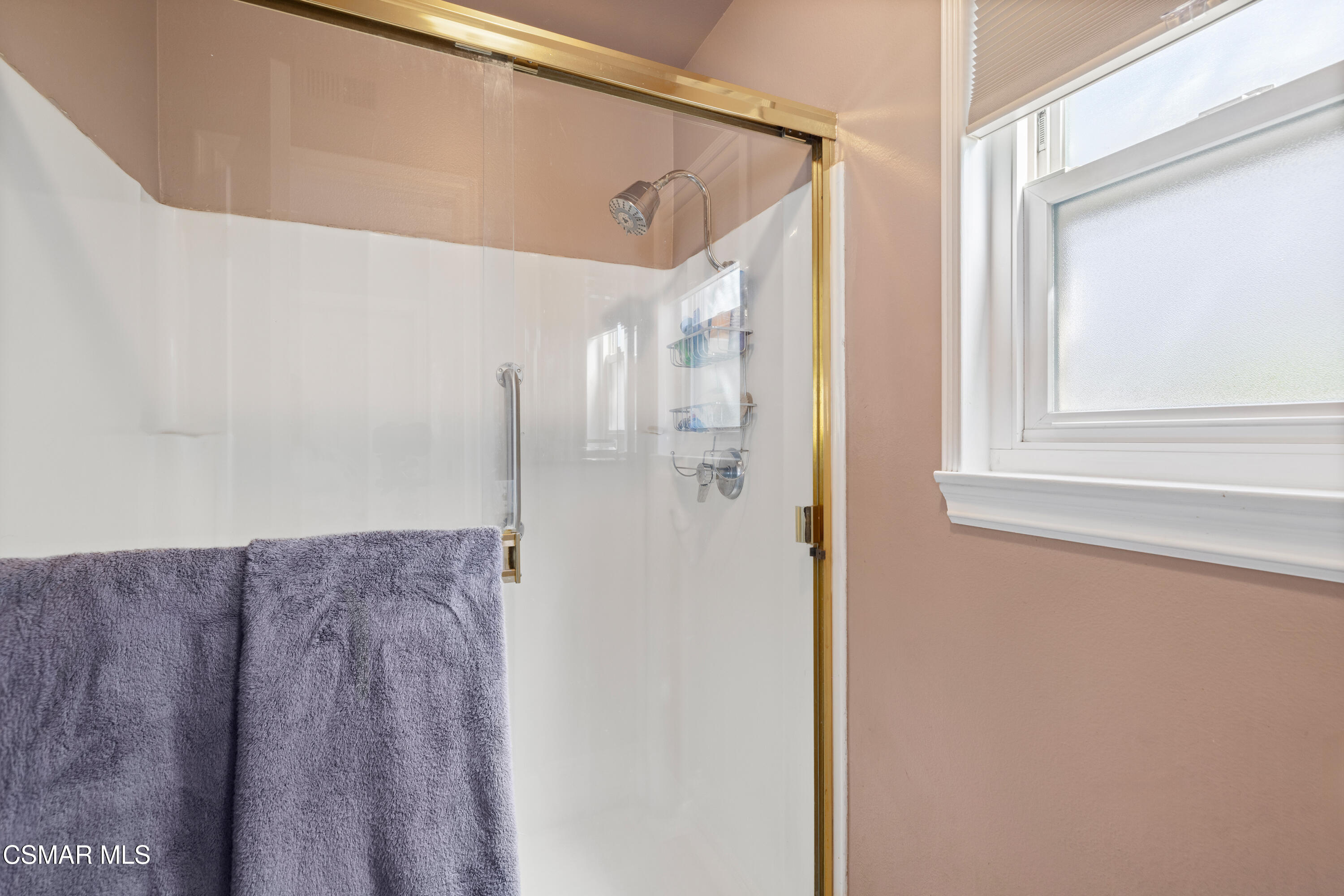 5914 Cochran Street Simi Valley, CA 93063 - Photo 14 of 23 a bathroom with a glass shower door