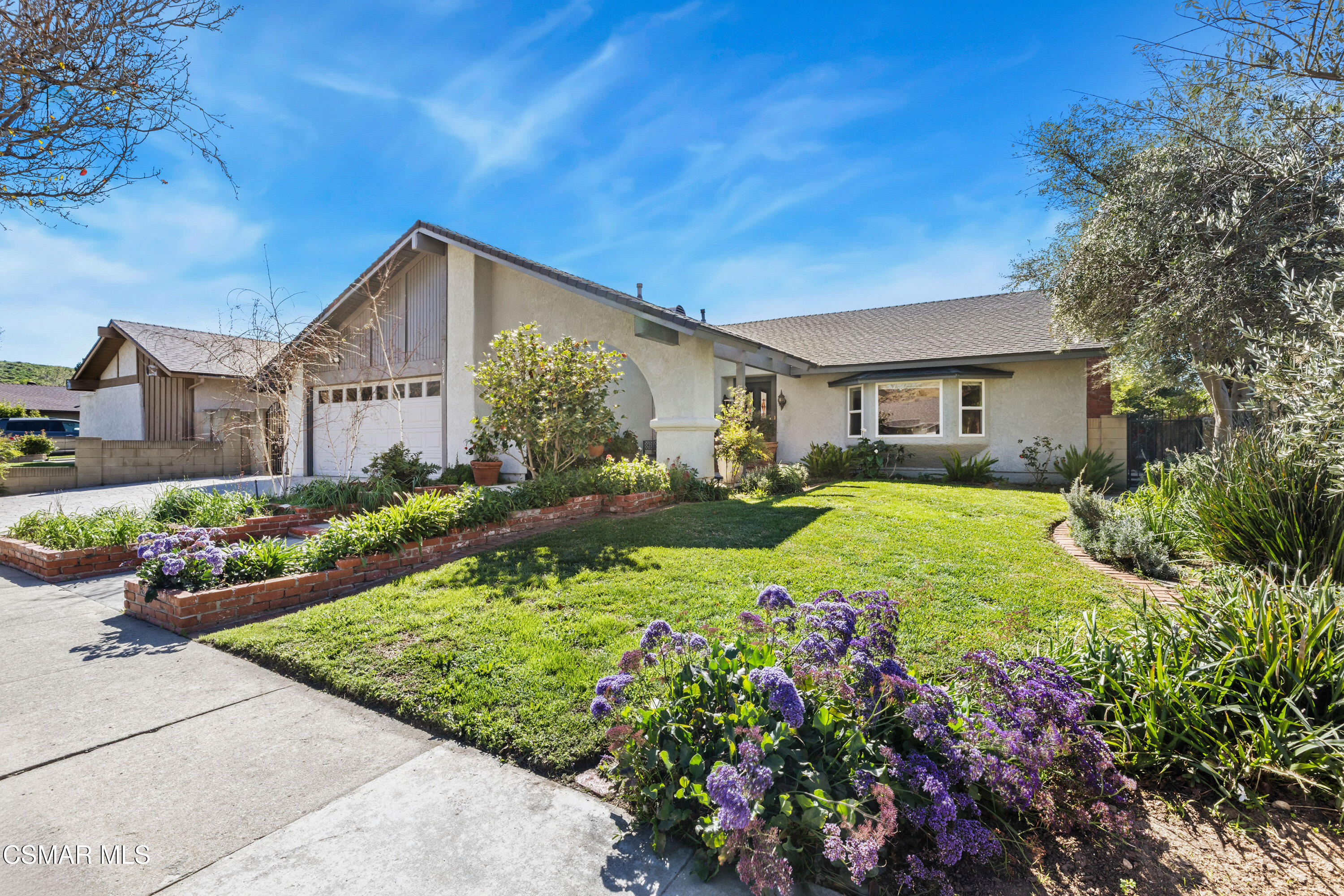 5914 Cochran Street Simi Valley, CA 93063 - Photo 2 of 23 a view of a house with a big yard and potted plants