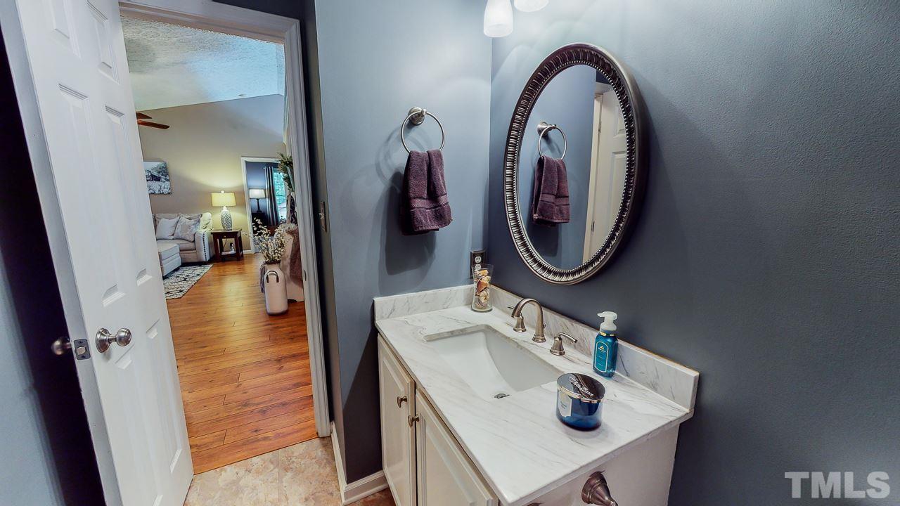 3612 Moriah Road Rougemont, NC 27572 - Photo 22 of 29 a bathroom with a sink double vanity and a mirror