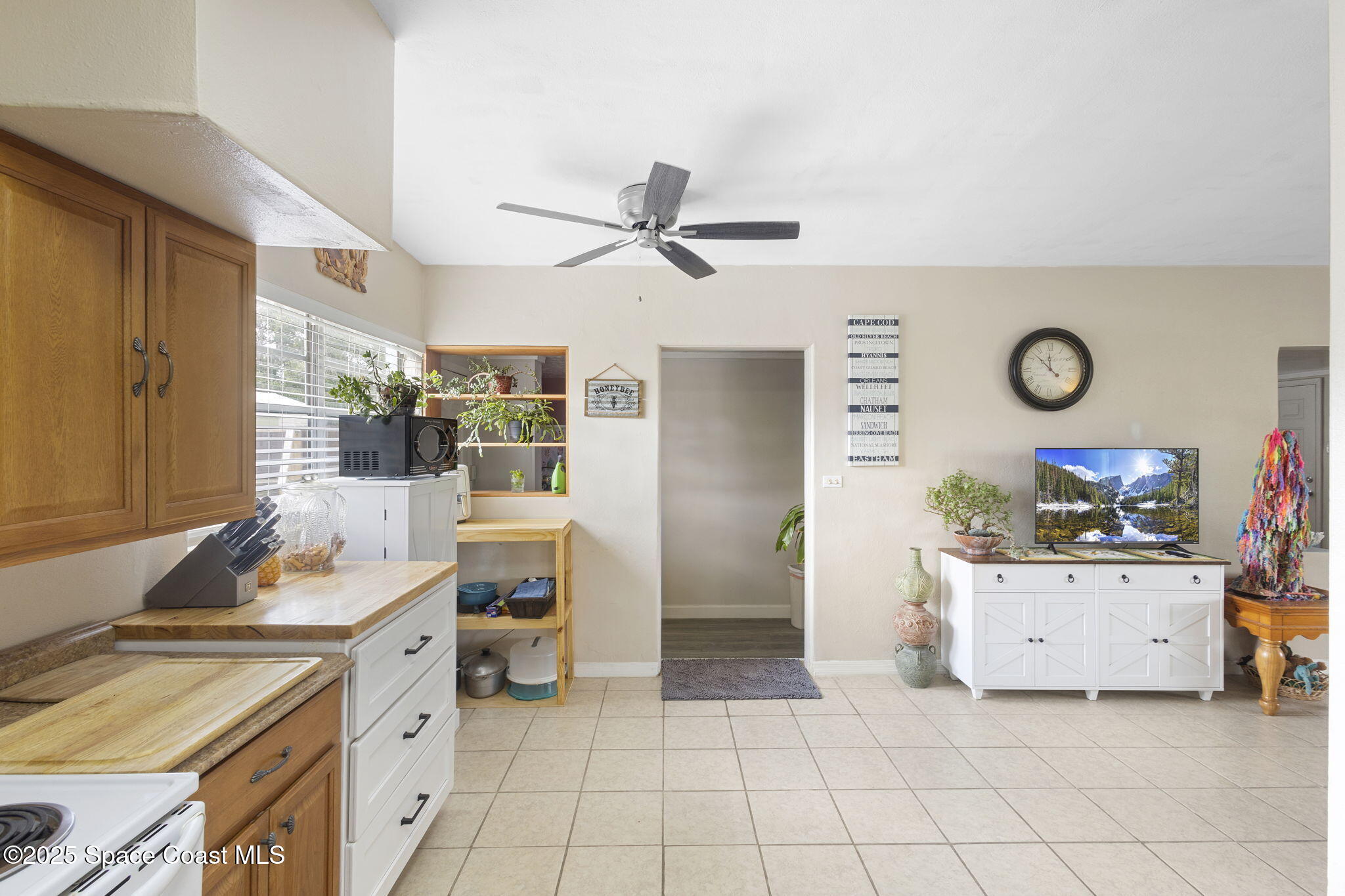 4535 Moon Road Titusville, FL 32780 - Photo 14 of 37 a kitchen with a sink cabinets and window