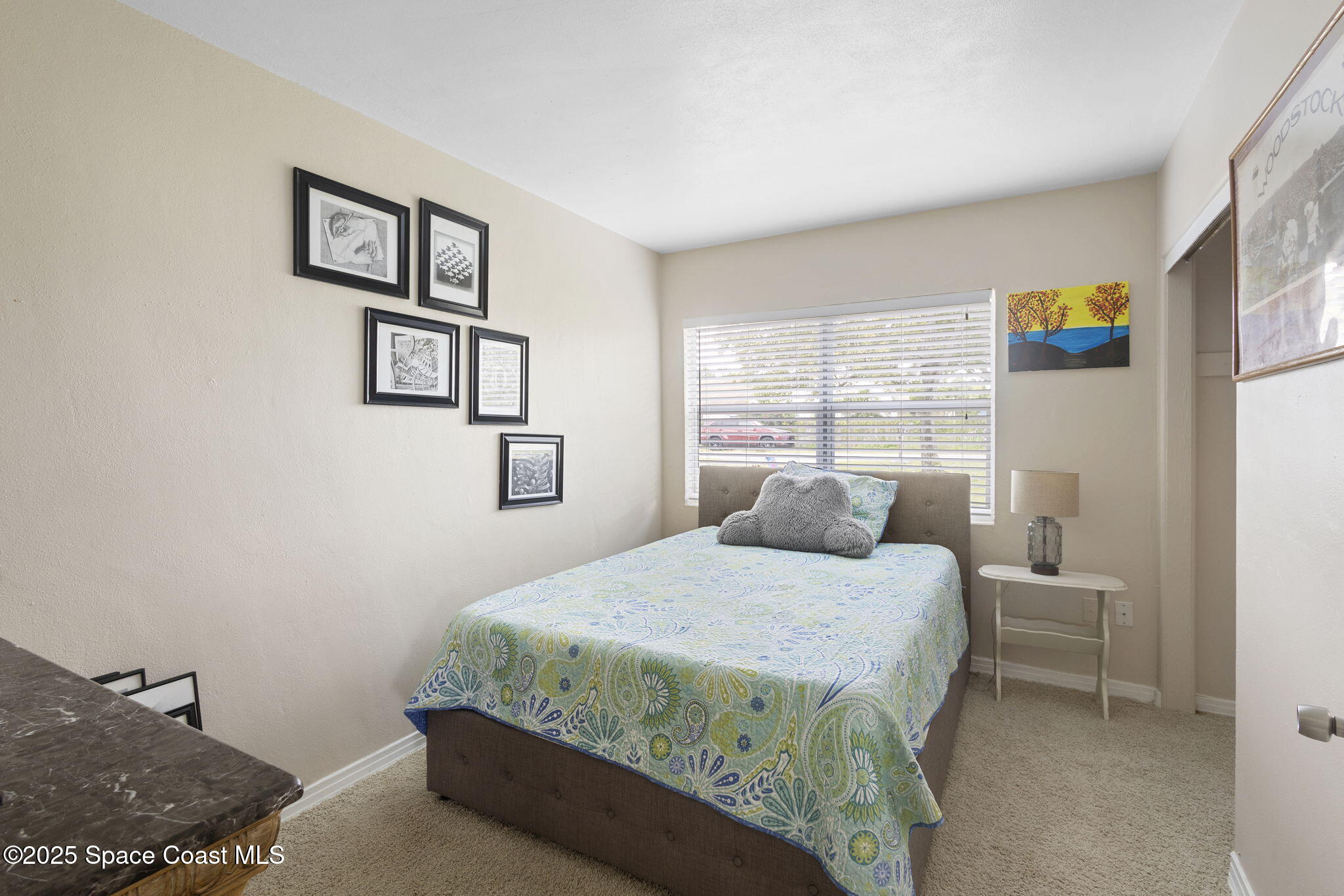 4535 Moon Road Titusville, FL 32780 - Photo 16 of 37 a bedroom with a bed and a window
