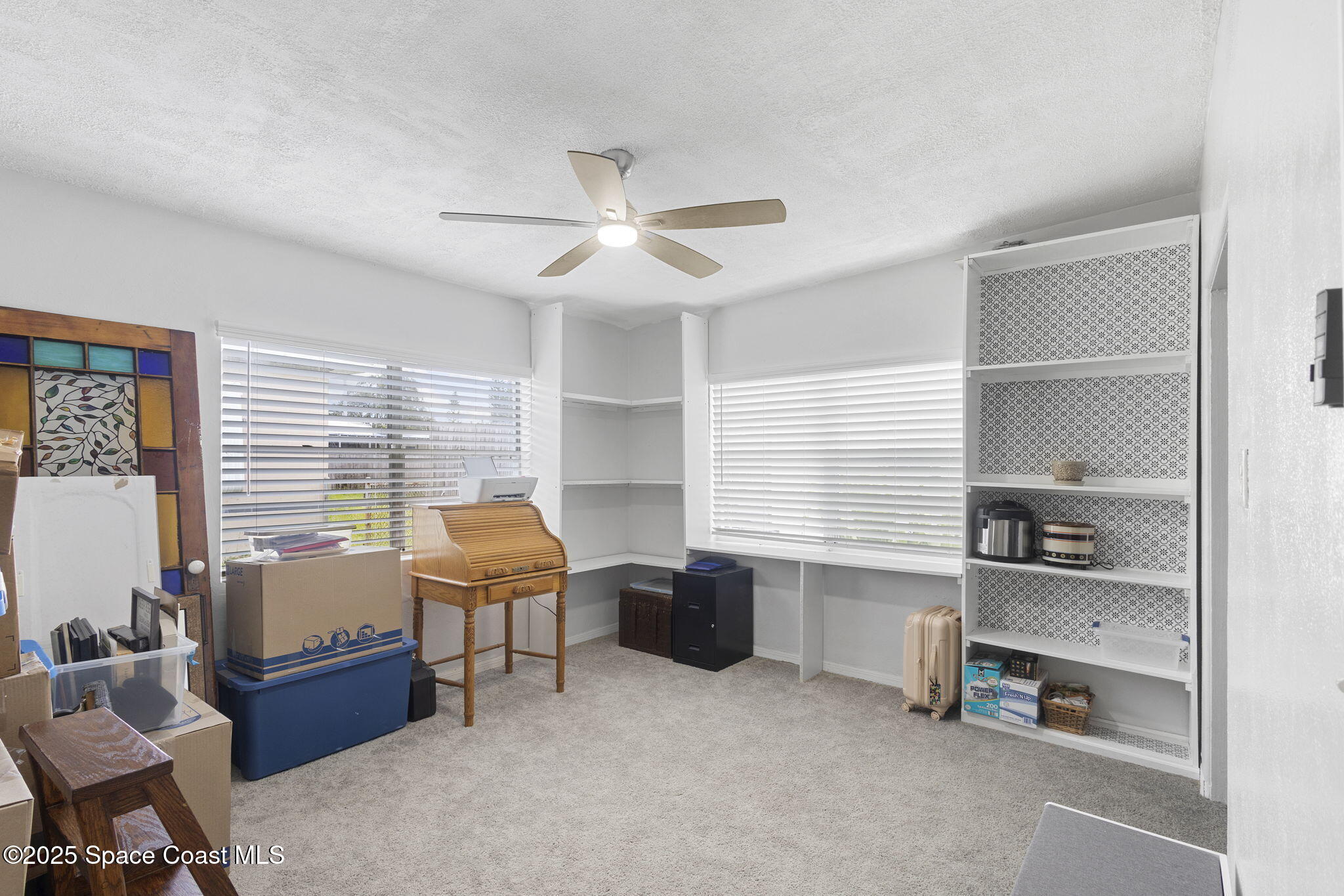 4535 Moon Road Titusville, FL 32780 - Photo 17 of 37 a bedroom with furniture and a window
