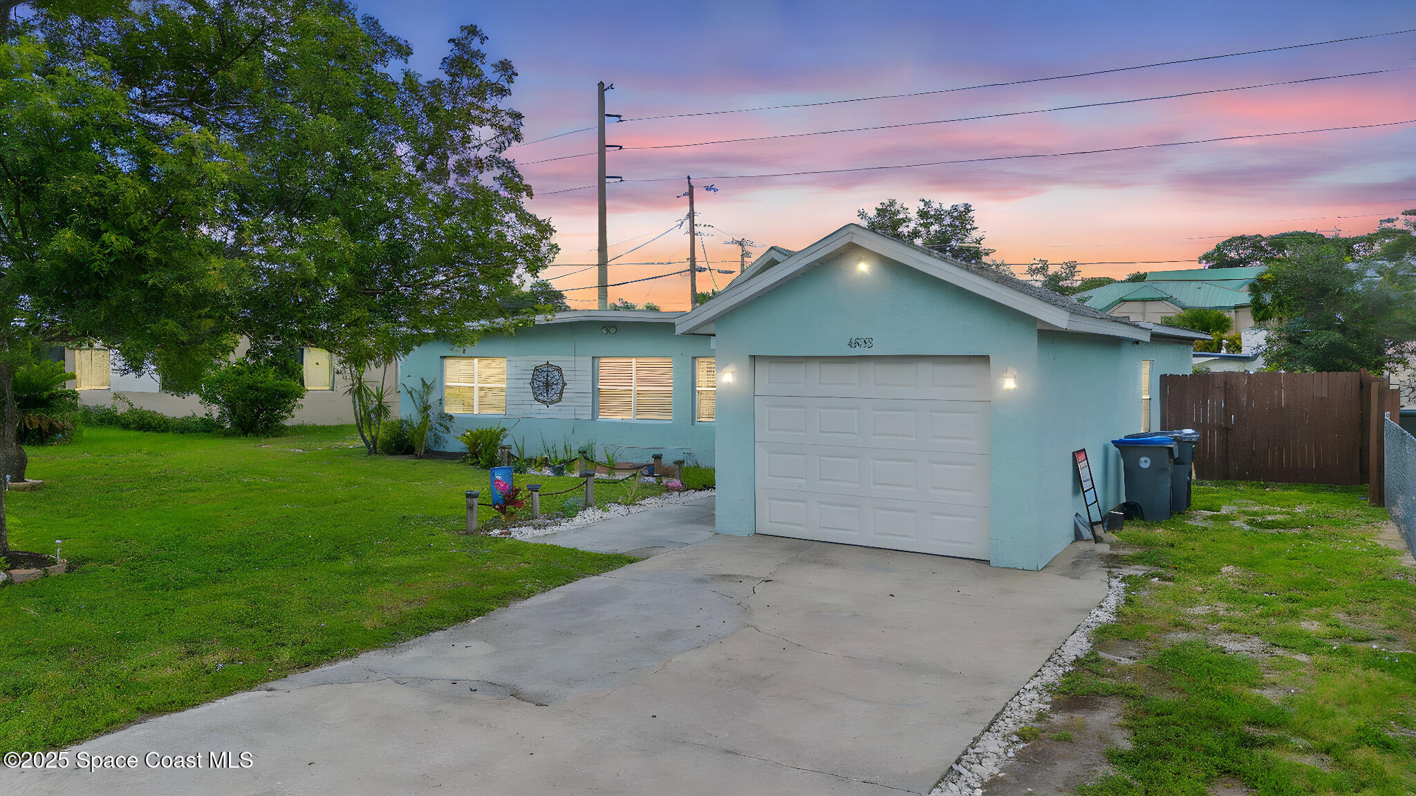 4535 Moon Road Titusville, FL 32780 - Photo 2 of 37 a front view of house with a garden