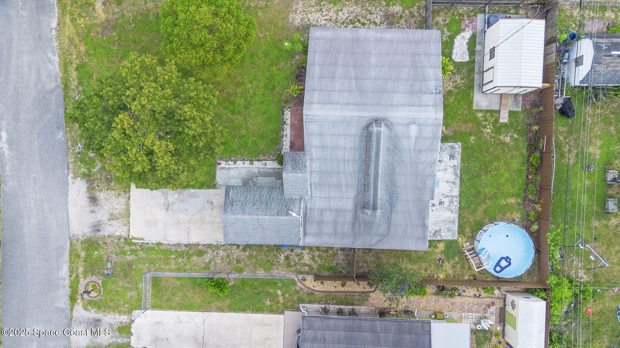4535 Moon Road Titusville, FL 32780 - Photo 25 of 37 a front view of a house with garden