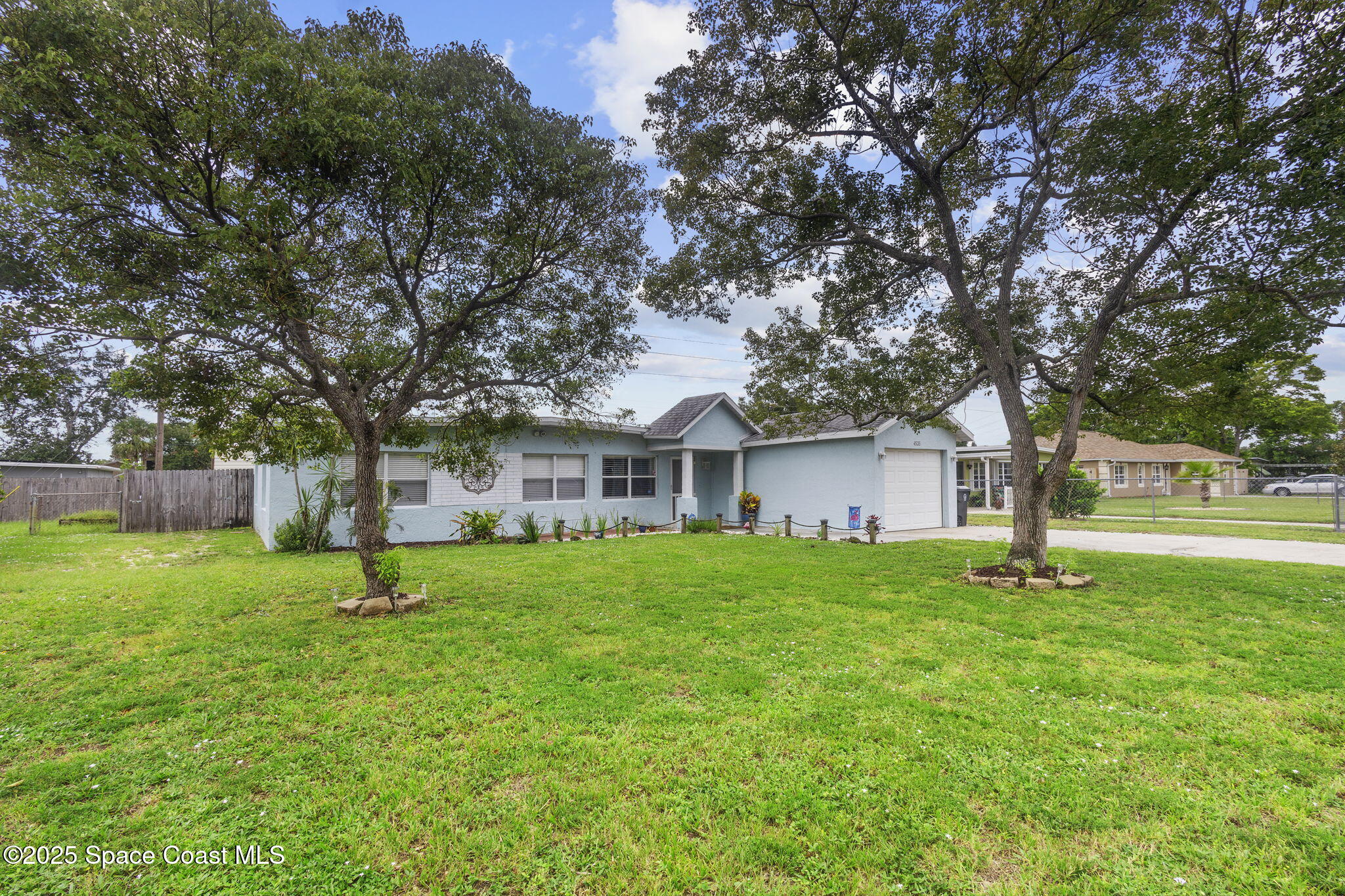 4535 Moon Road Titusville, FL 32780 - Photo 29 of 37 a house is sitting in middle od the grass