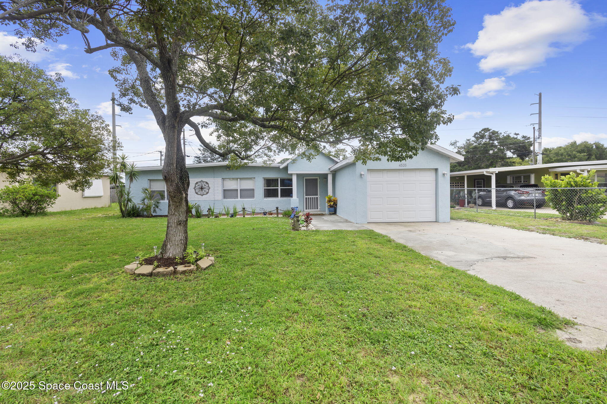 4535 Moon Road Titusville, FL 32780 - Photo 30 of 37 a front view of house with yard and green space