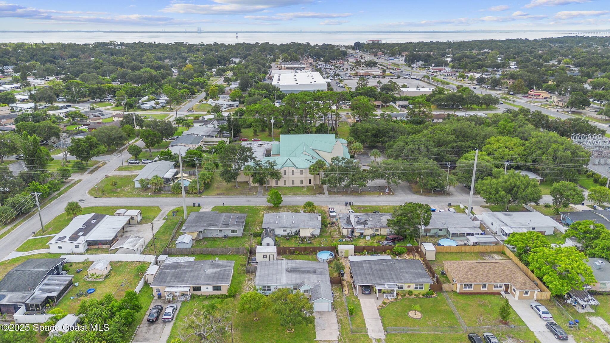 4535 Moon Road Titusville, FL 32780 - Photo 34 of 37 an aerial view of residential houses with outdoor space
