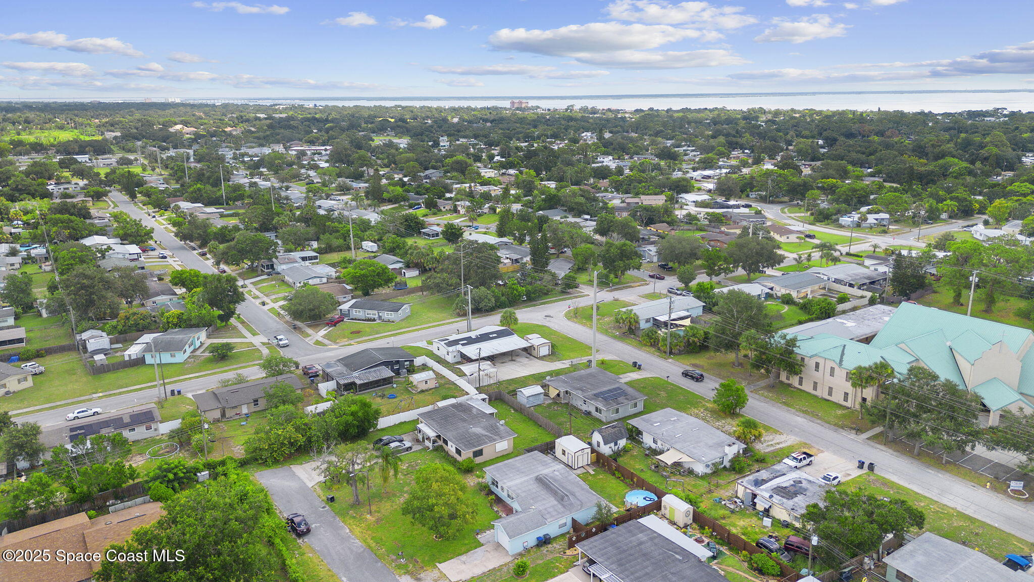 4535 Moon Road Titusville, FL 32780 - Photo 35 of 37 an aerial view of residential houses with outdoor space