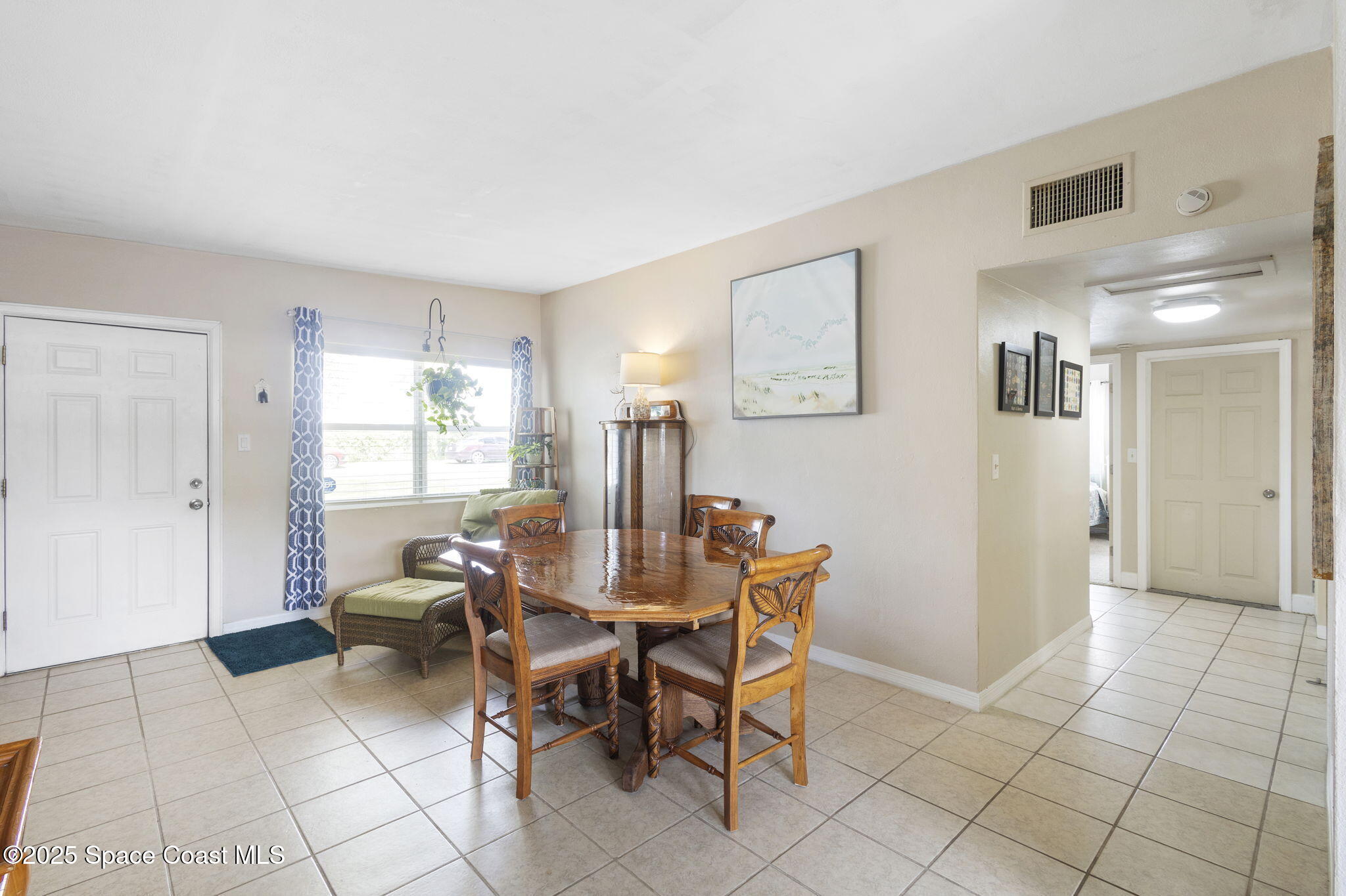 4535 Moon Road Titusville, FL 32780 - Photo 7 of 37 a view of a livingroom with furniture and a window