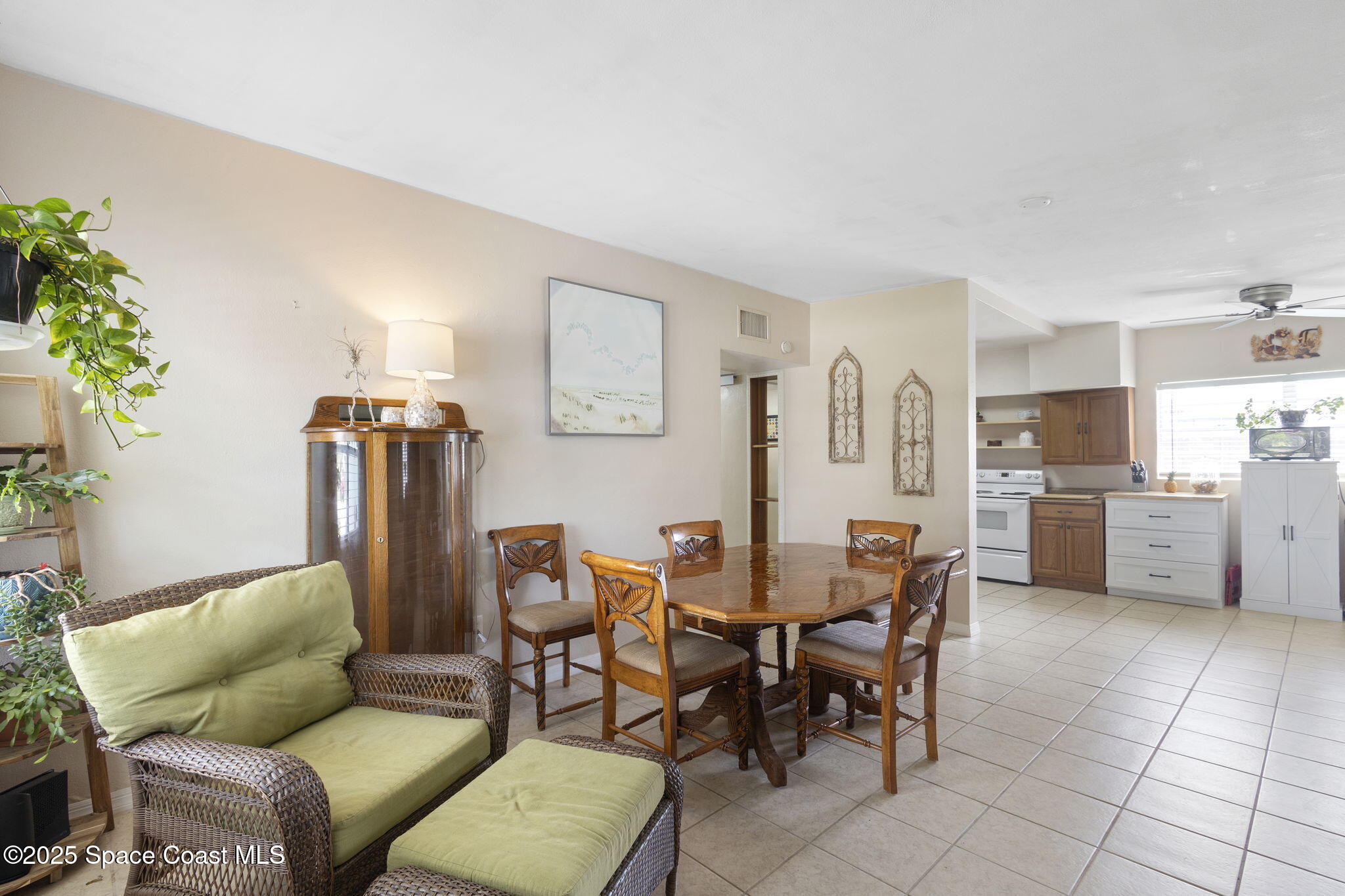 4535 Moon Road Titusville, FL 32780 - Photo 8 of 37 a view of a dining room with furniture and a kitchen