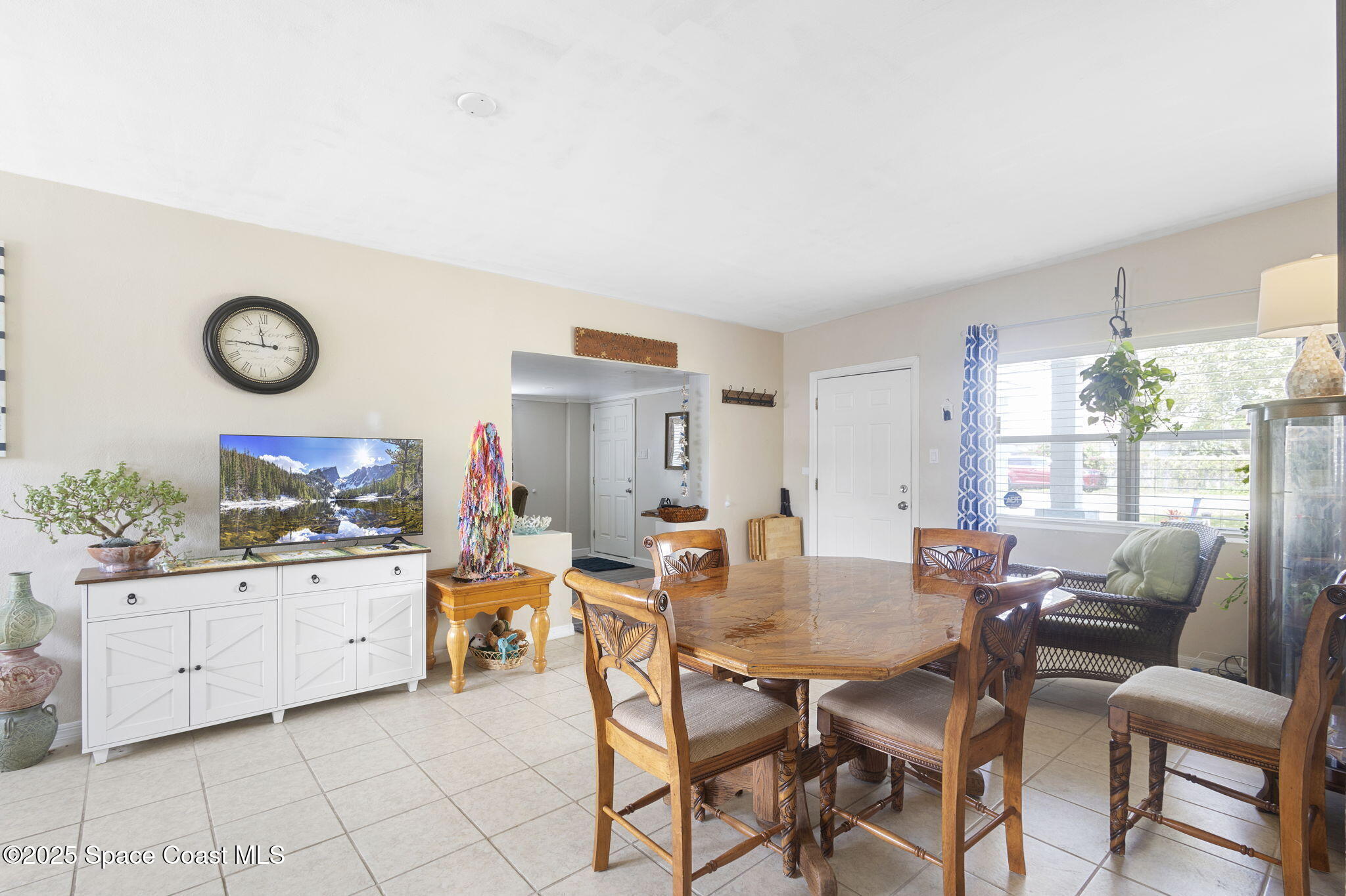 4535 Moon Road Titusville, FL 32780 - Photo 10 of 37 a dining room with furniture and a large window