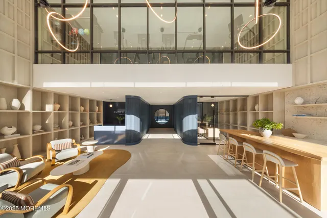 a view of a chairs and table in the balcony