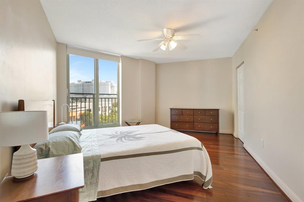 610 Clematis Street, Unit 412 West Palm Beach, FL 33401 - Photo 13 of 52 a bedroom with a large bed and a window