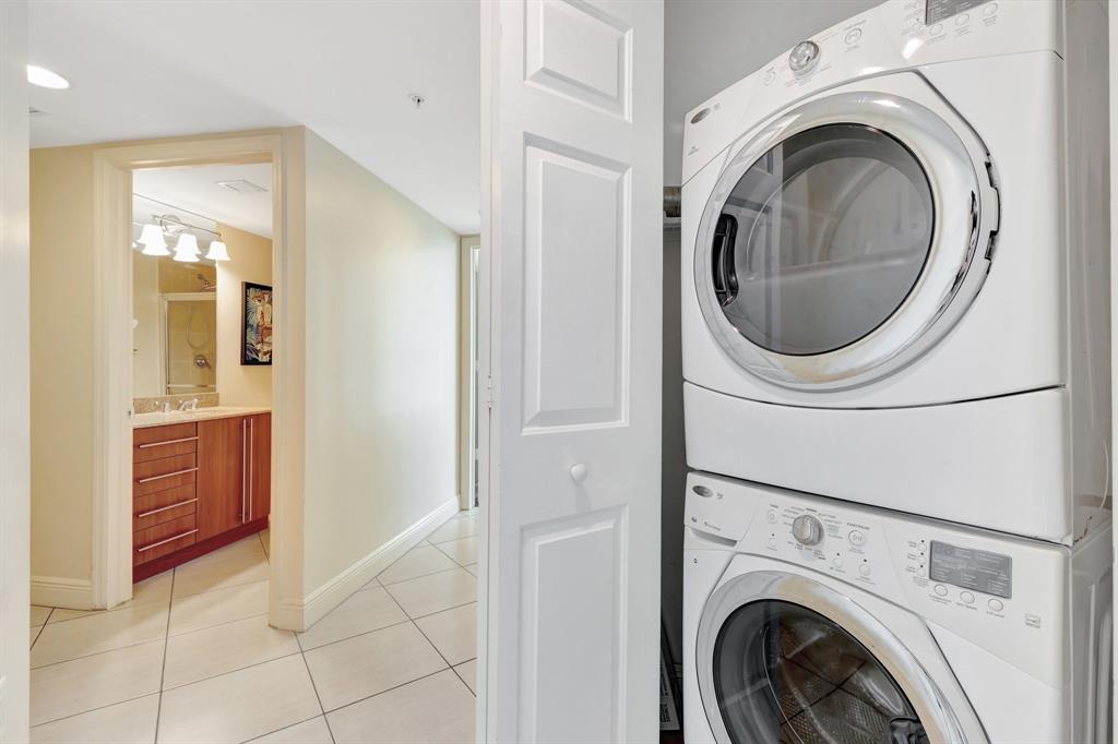 610 Clematis Street, Unit 412 West Palm Beach, FL 33401 - Photo 20 of 52 a view of a hallway with washer and dryer