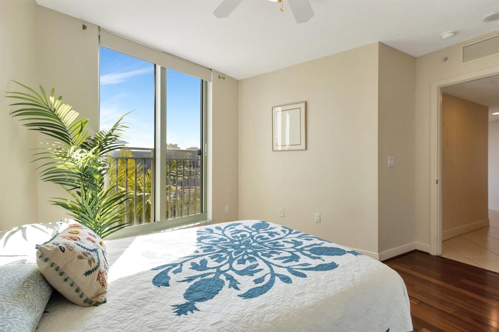 610 Clematis Street, Unit 412 West Palm Beach, FL 33401 - Photo 21 of 52 a bedroom with a bed and a window