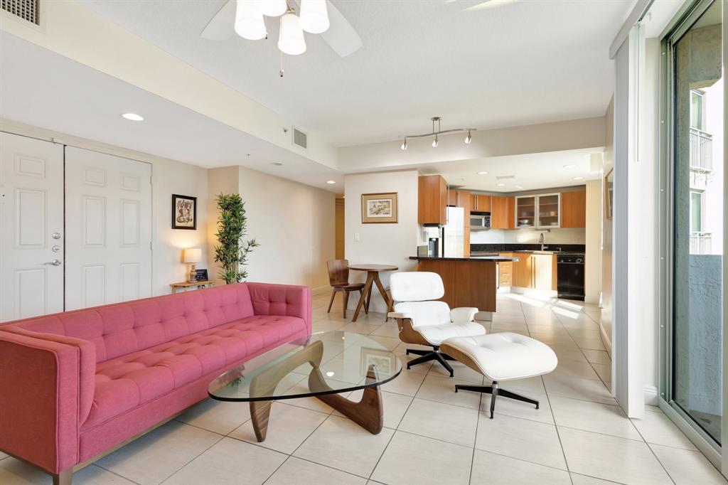 610 Clematis Street, Unit 412 West Palm Beach, FL 33401 - Photo 4 of 52 a living room with furniture and a table