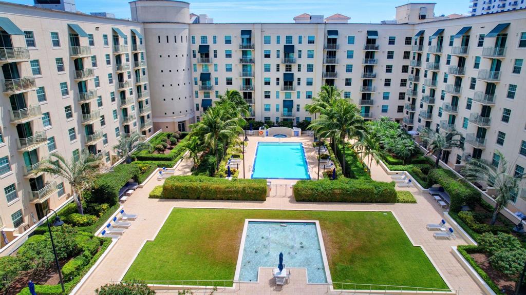 610 Clematis Street, Unit 412 West Palm Beach, FL 33401 - Photo 44 of 52 a view of building with garden