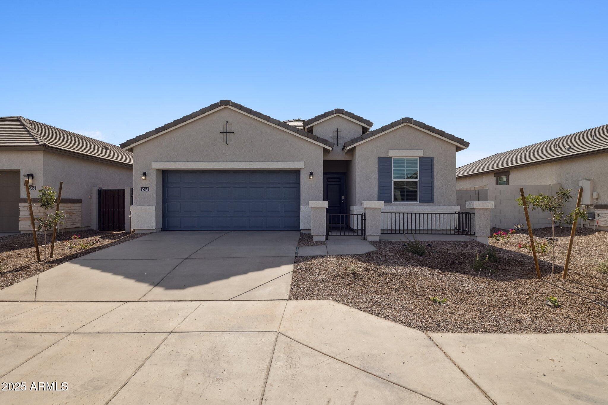 a front view of a house with garage