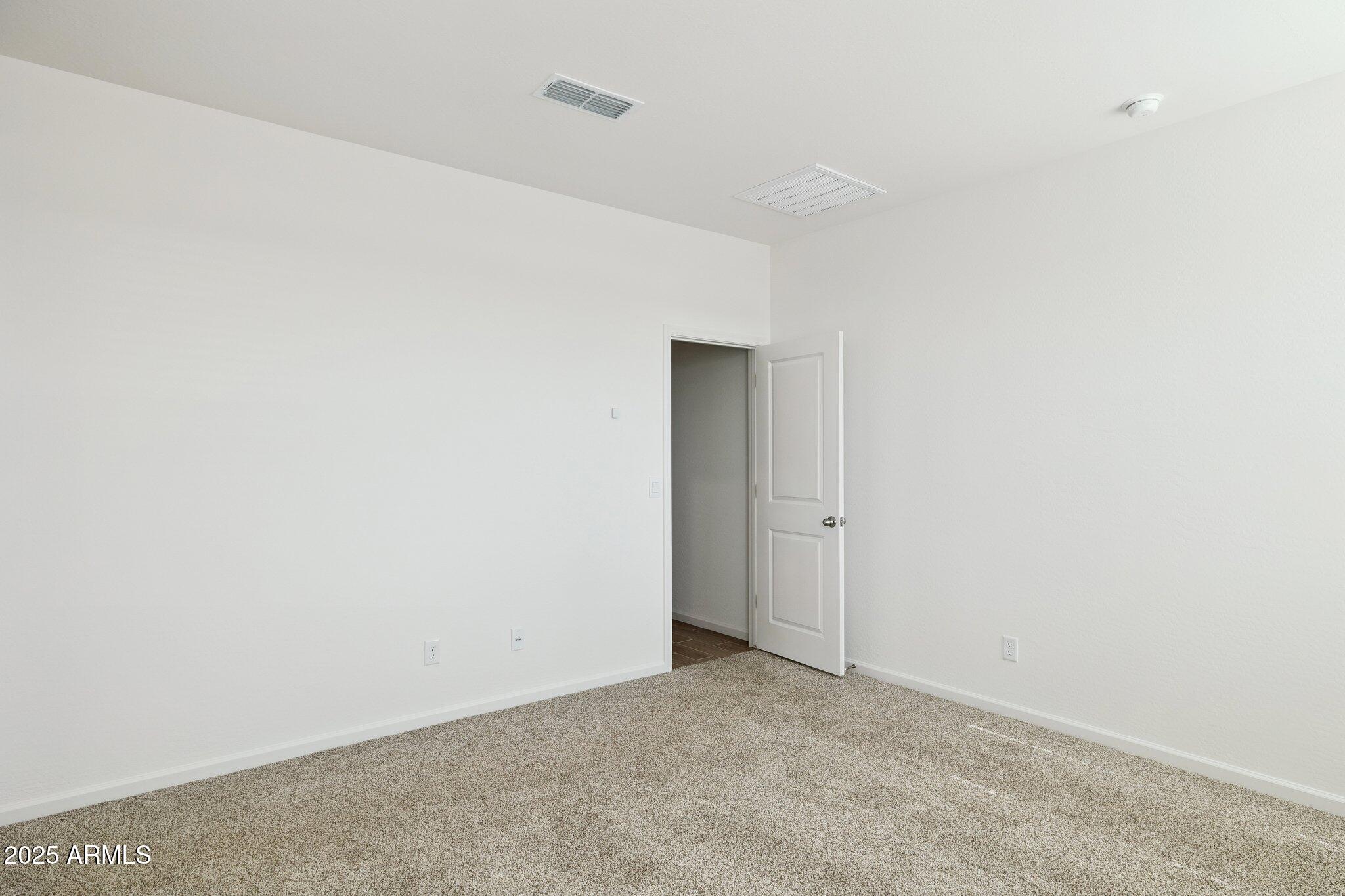 25459 West Fraktur Road Buckeye, AZ 85326 - Photo 6 of 14 a view of an empty room