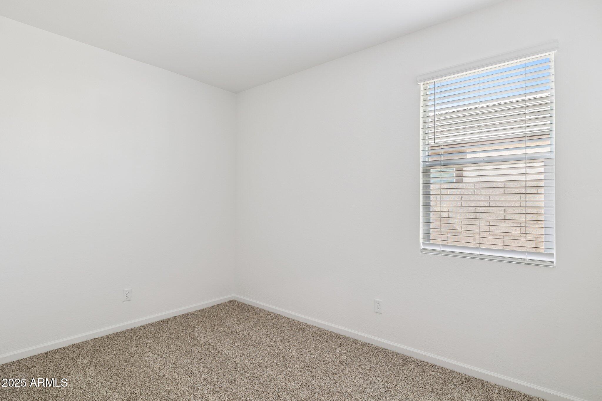 25459 West Fraktur Road Buckeye, AZ 85326 - Photo 9 of 14 an empty room with a window