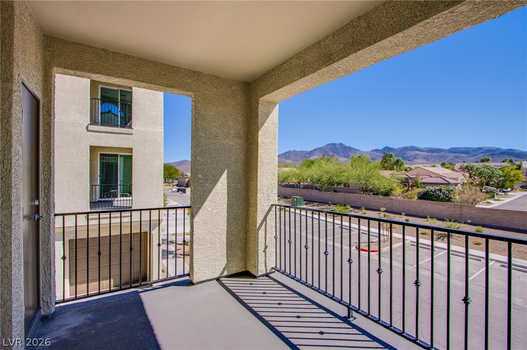 2555 Hampton Road, Unit 8201 Henderson, NV 89052 - Photo 12 of 33 A private covered balcony frames scenic views of the surrounding mountains and neighborhood.