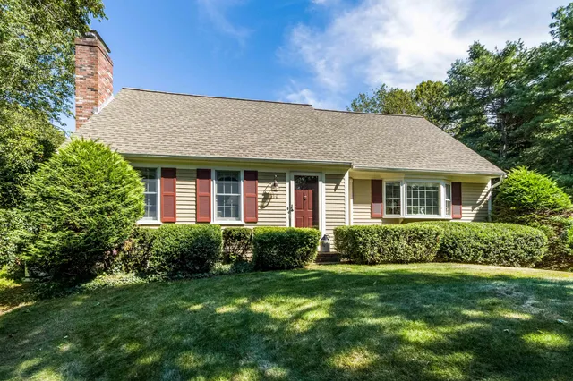 a view of a house with garden and yard