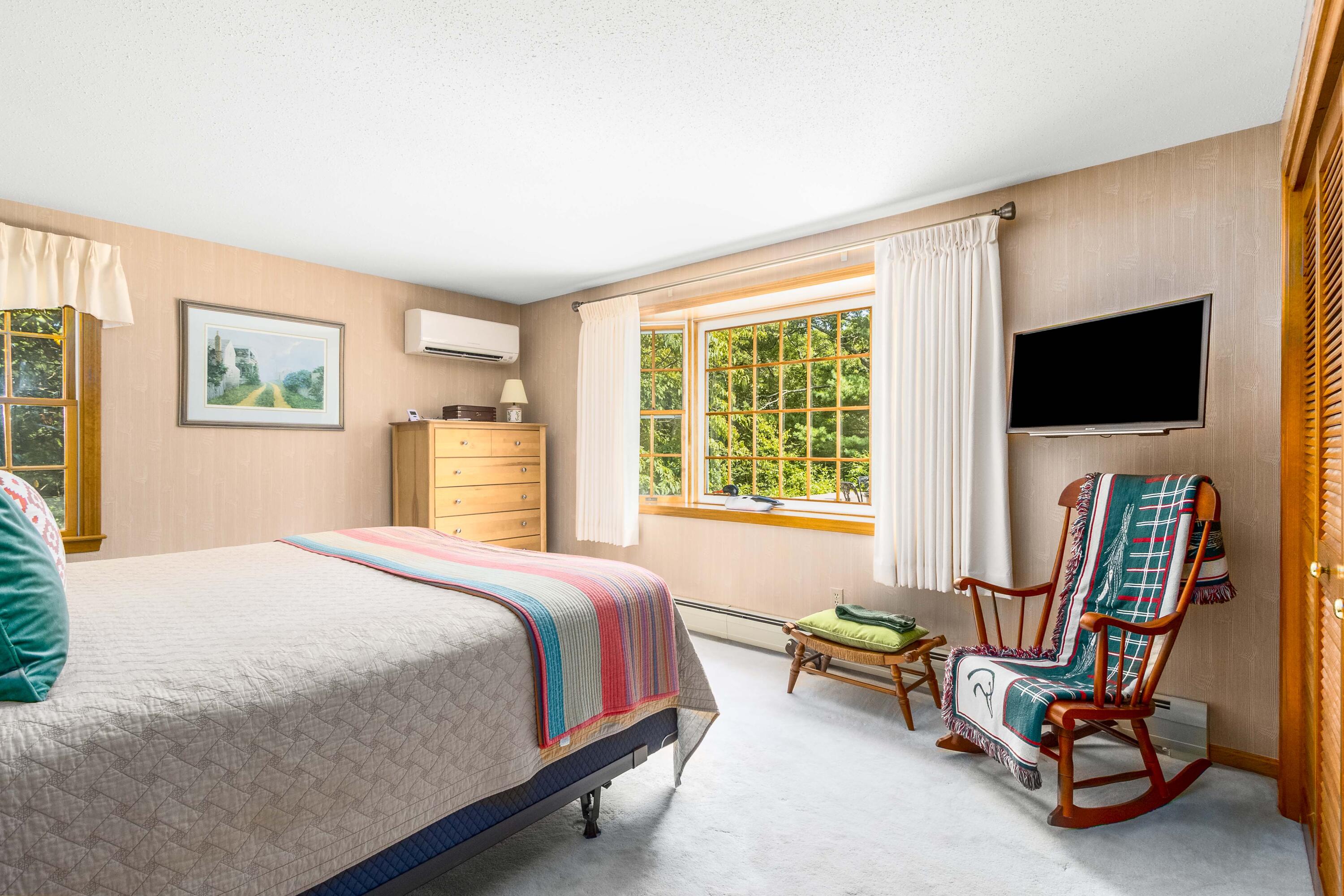 110 Marble Road Barnstable, MA 02630 - Photo 16 of 33 a bedroom with a bed a television and a window