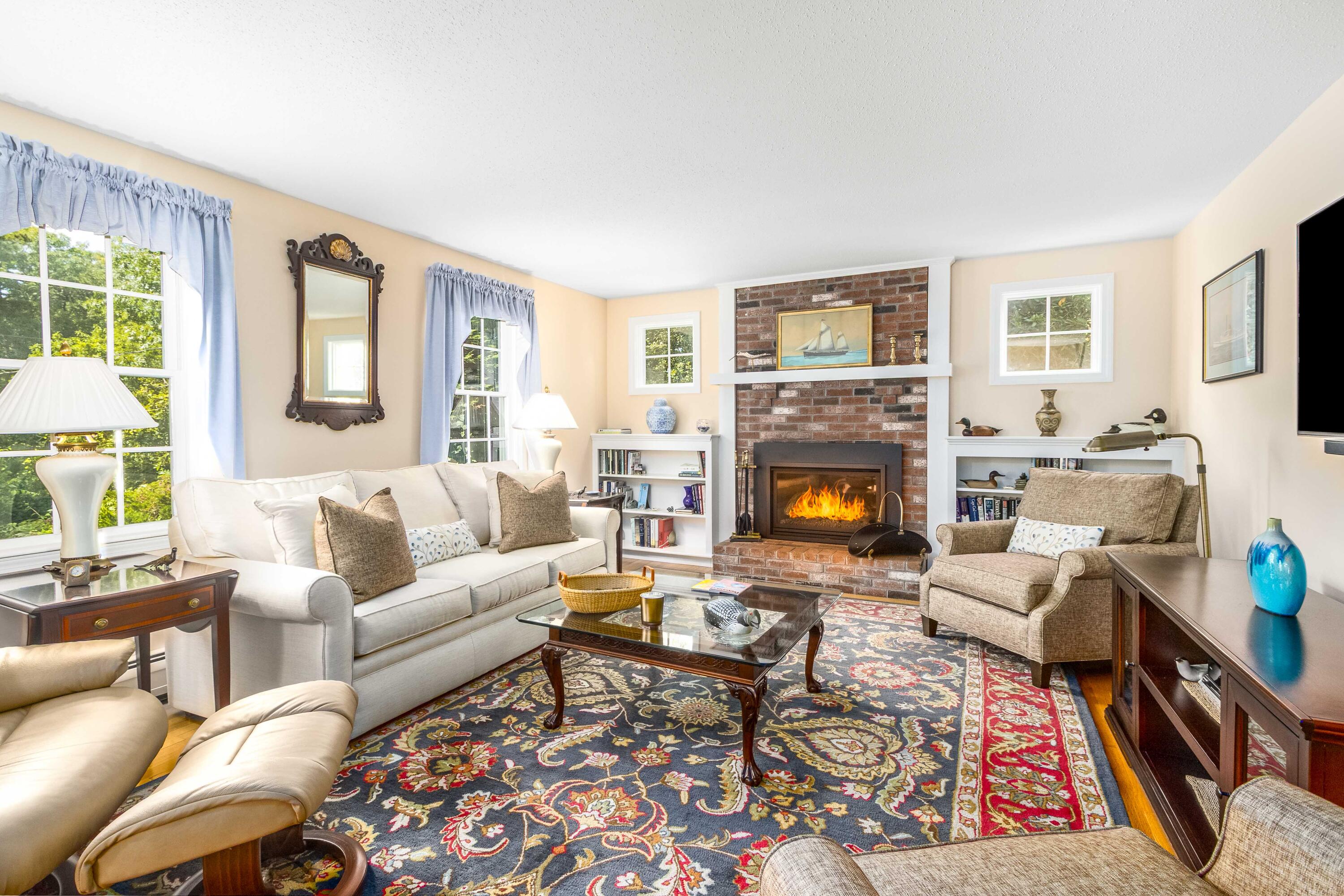 110 Marble Road Barnstable, MA 02630 - Photo 4 of 33 a living room with furniture large window and a fireplace