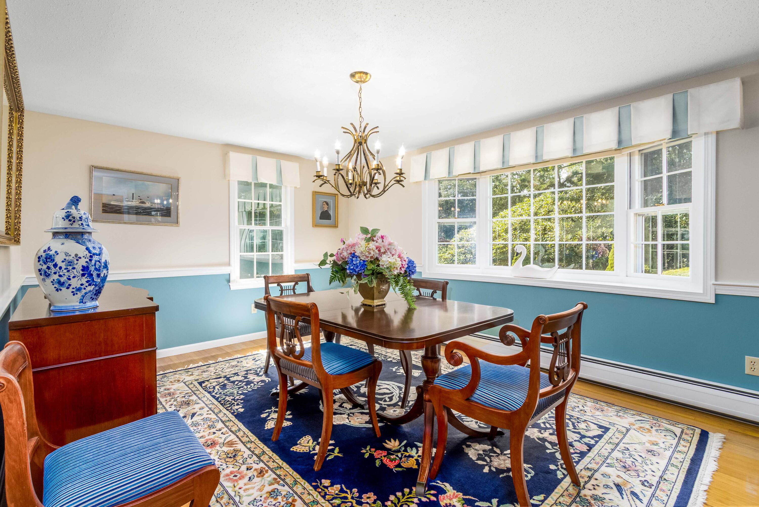 110 Marble Road Barnstable, MA 02630 - Photo 7 of 33 a dining room with furniture a rug and a chandelier
