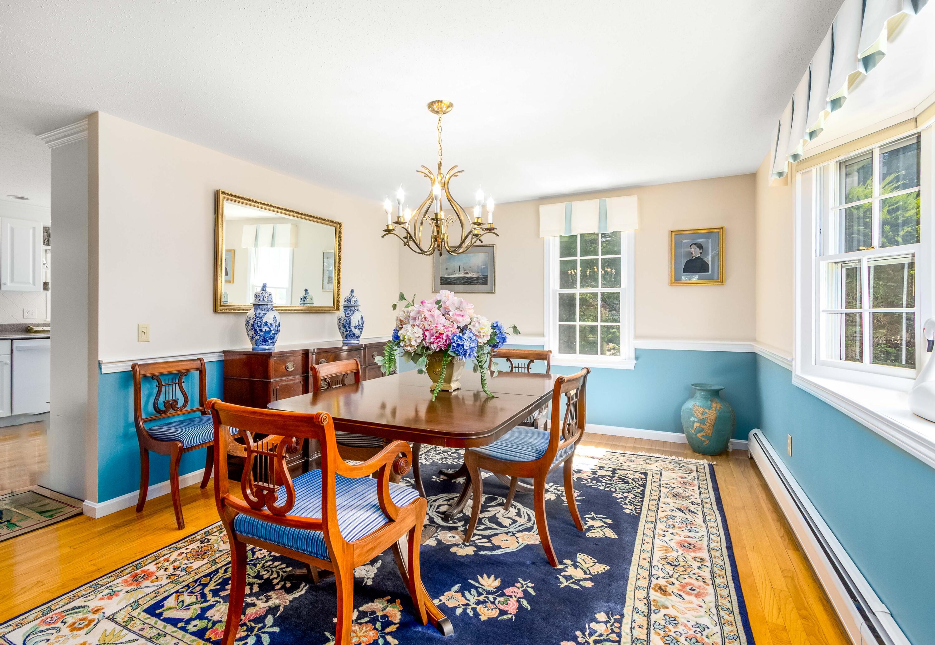 110 Marble Road Barnstable, MA 02630 - Photo 8 of 33 a dining room with furniture a chandelier and wooden floor