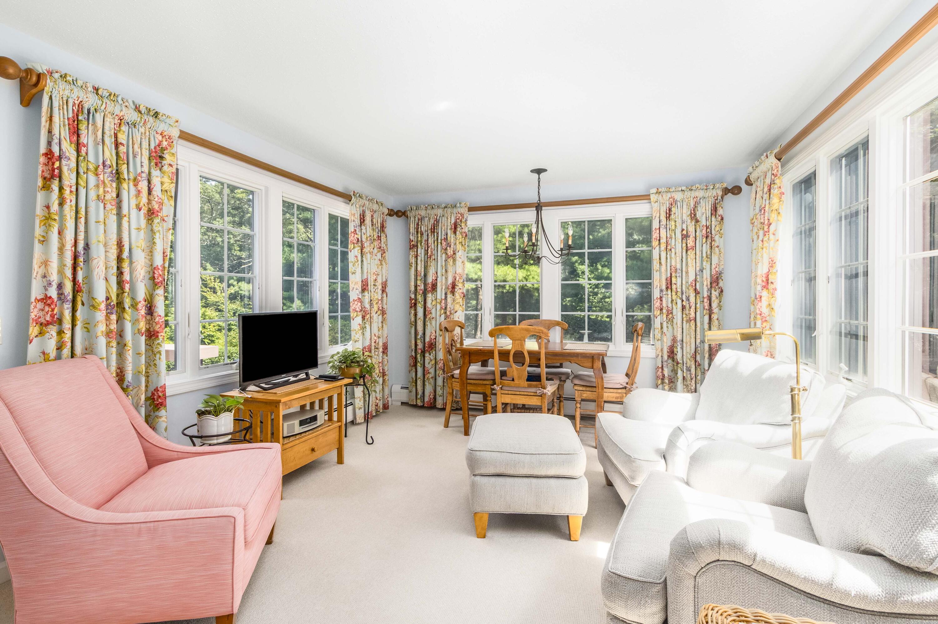110 Marble Road Barnstable, MA 02630 - Photo 9 of 33 a living room with furniture a flat screen tv and a large window