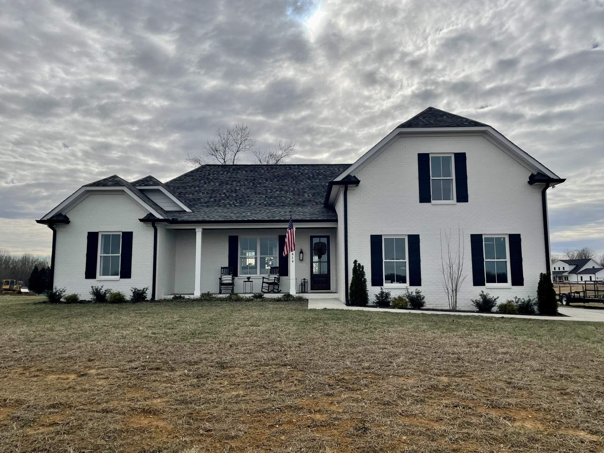 1414 Fowler Ford Road Portland, TN 37148 - Photo 1 of 52 a front view of house with yard and trees in the background