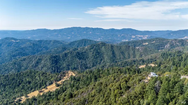 a view of a backyard with sitting area