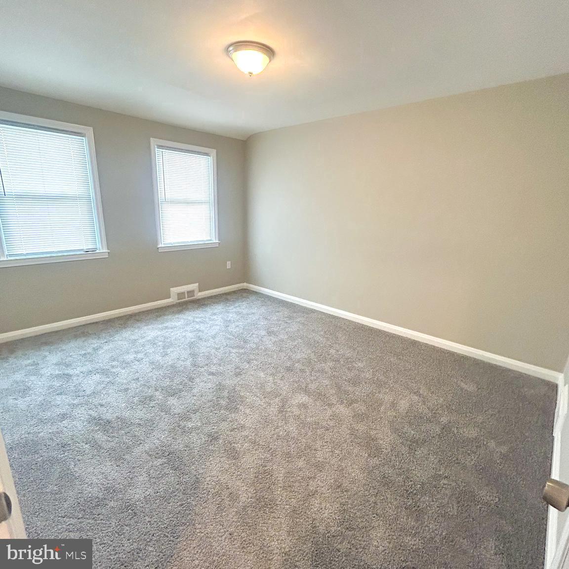 1260 Cedarcroft Road Baltimore, MD 21239 - Photo 12 of 18 an empty room with windows