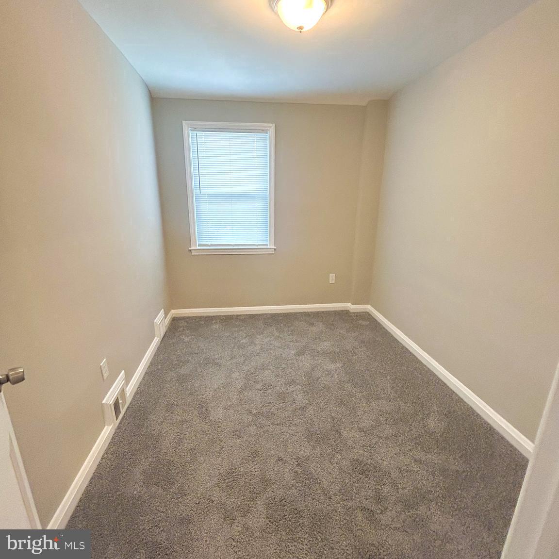1260 Cedarcroft Road Baltimore, MD 21239 - Photo 14 of 18 an empty room with a window