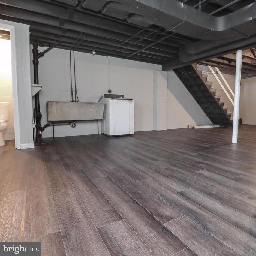 1260 Cedarcroft Road Baltimore, MD 21239 - Photo 16 of 18 a view of wooden floor in an empty room