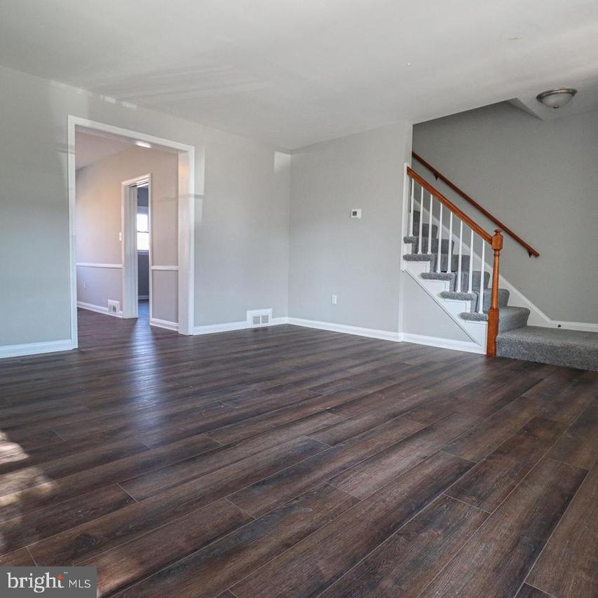 1260 Cedarcroft Road Baltimore, MD 21239 - Photo 2 of 18 a view of an entryway with wooden floor