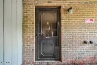 a bathroom with a shower and a sink