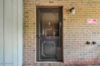 a bathroom with a shower and a sink