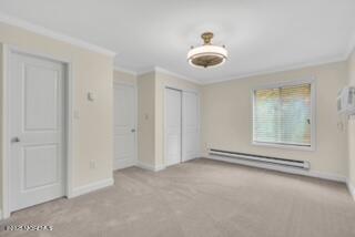 204 Covered Bridge Boulevard, Unit D Manalapan, NJ 07726 - Photo 12 of 20 a view of an empty room with a window