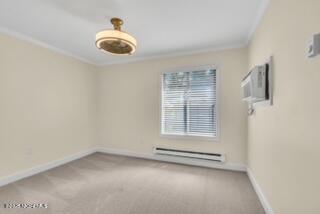 204 Covered Bridge Boulevard, Unit D Manalapan, NJ 07726 - Photo 16 of 20 an empty room with a empty space and windows