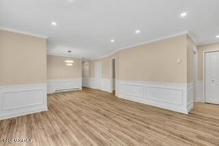204 Covered Bridge Boulevard, Unit D Manalapan, NJ 07726 - Photo 7 of 20 a view of an empty room with wooden floor and closet