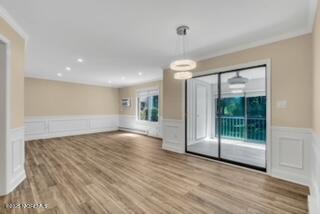 204 Covered Bridge Boulevard, Unit D Manalapan, NJ 07726 - Photo 8 of 20 a view of an empty room with wooden floor and a window
