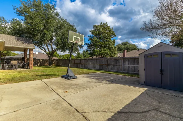 a backyard of a house with lots of green space