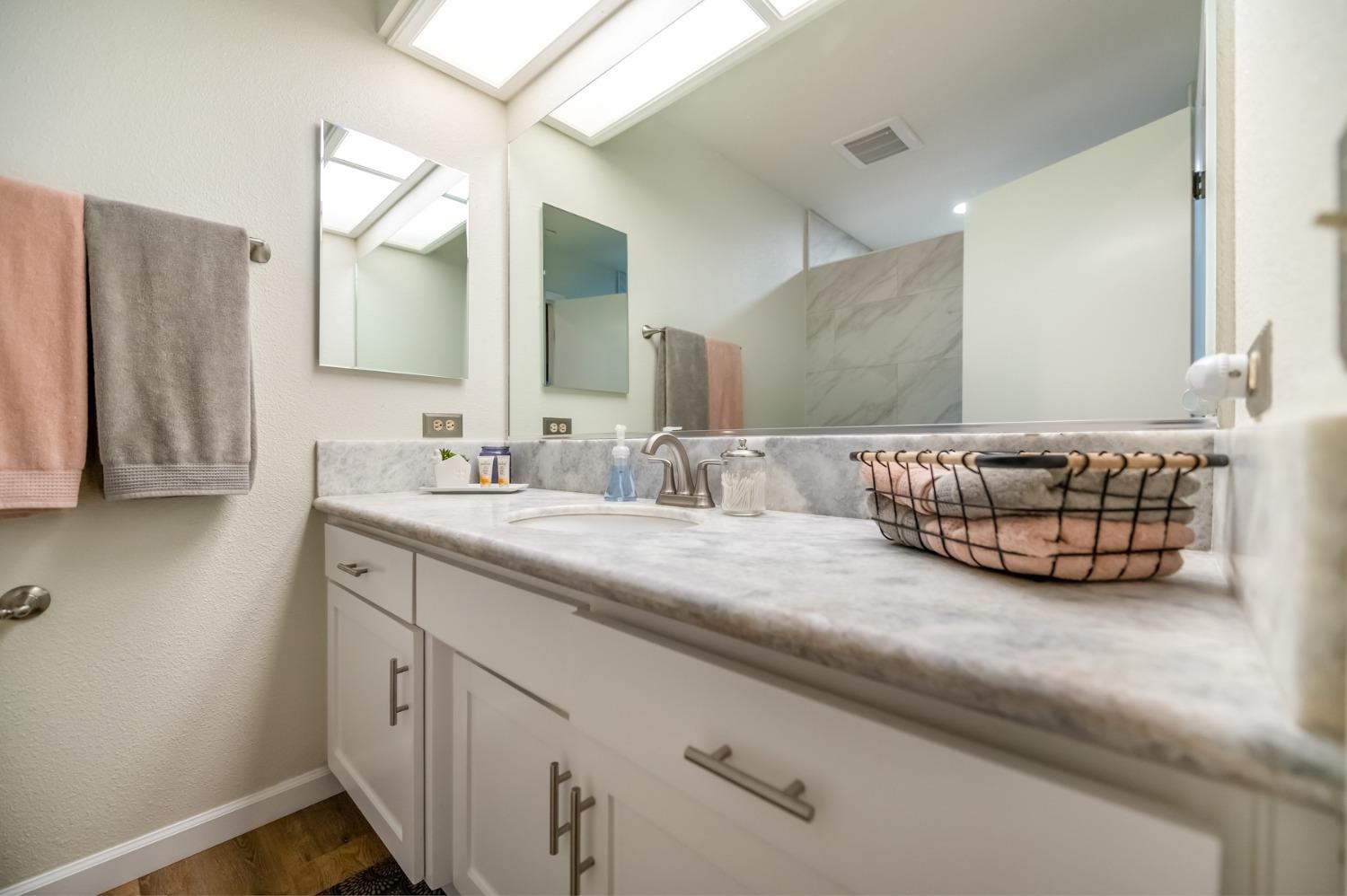 40984 Grouse Drive Three Rivers, CA 93271 - Photo 21 of 49 a bathroom with a double vanity sink and a mirror