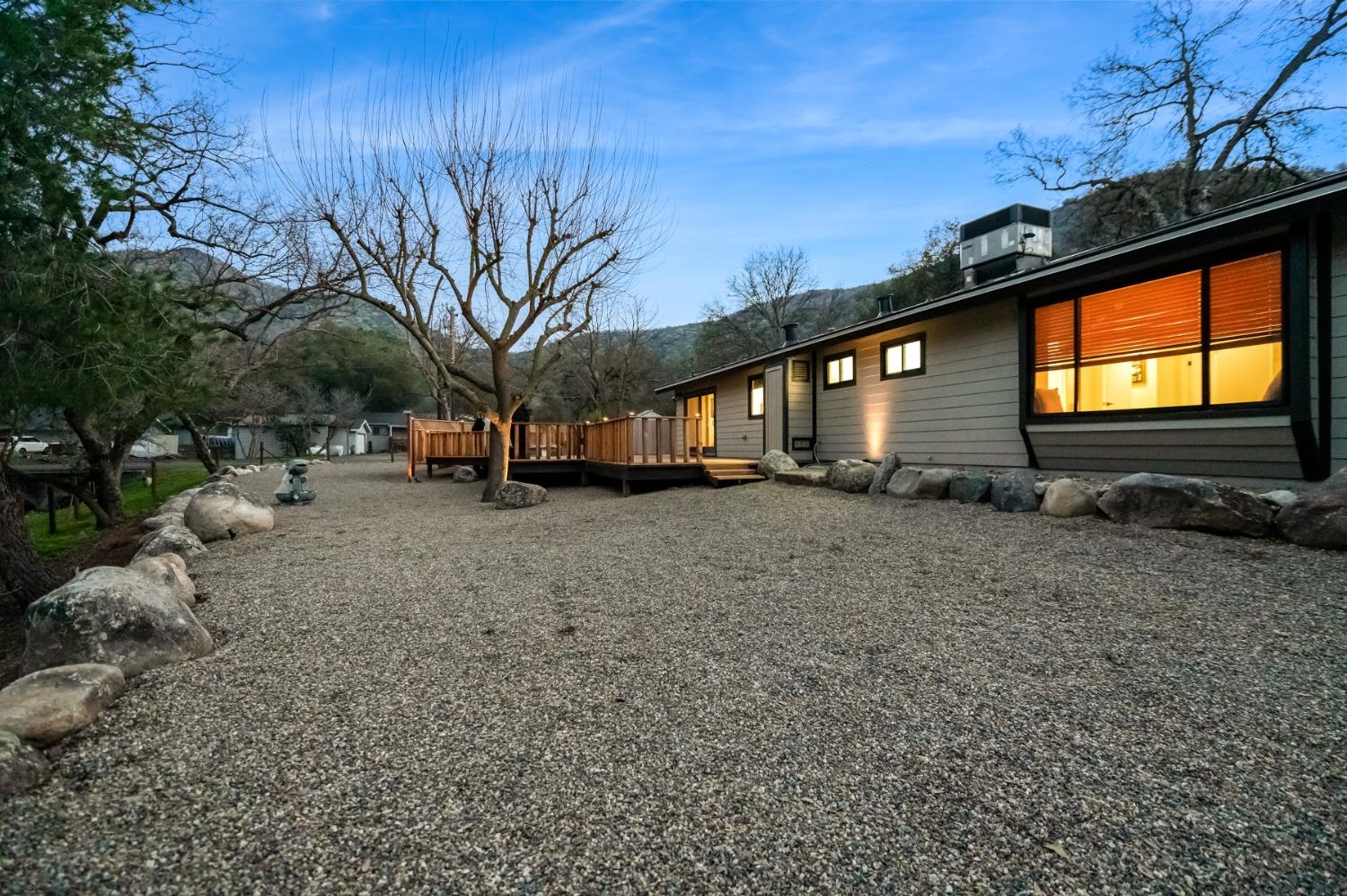 40984 Grouse Drive Three Rivers, CA 93271 - Photo 35 of 49 a backyard of a house with fire pit and couches
