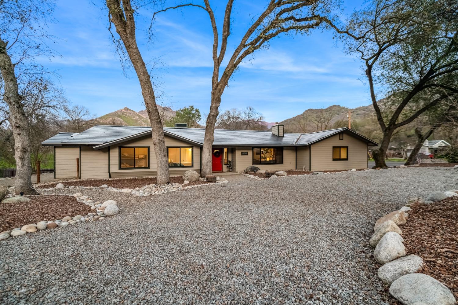 40984 Grouse Drive Three Rivers, CA 93271 - Photo 41 of 49 a view of a large house with a big yard and large tree