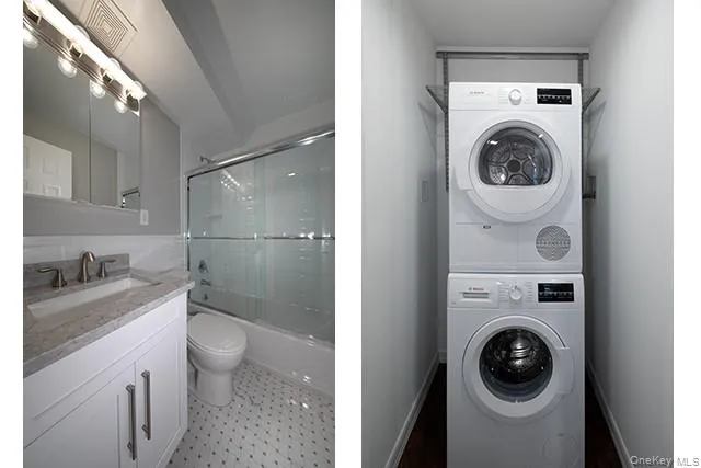 a view of a bathroom with washing machine and sink